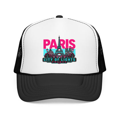 White trucker hat with black mesh sides and Paris City of Lights graphic, curved brim.