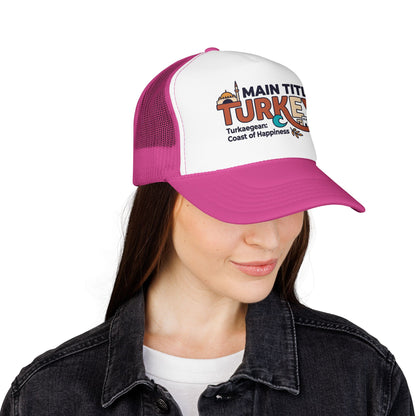 Hot pink and white foam trucker hat on model, front logo patch and mesh sides