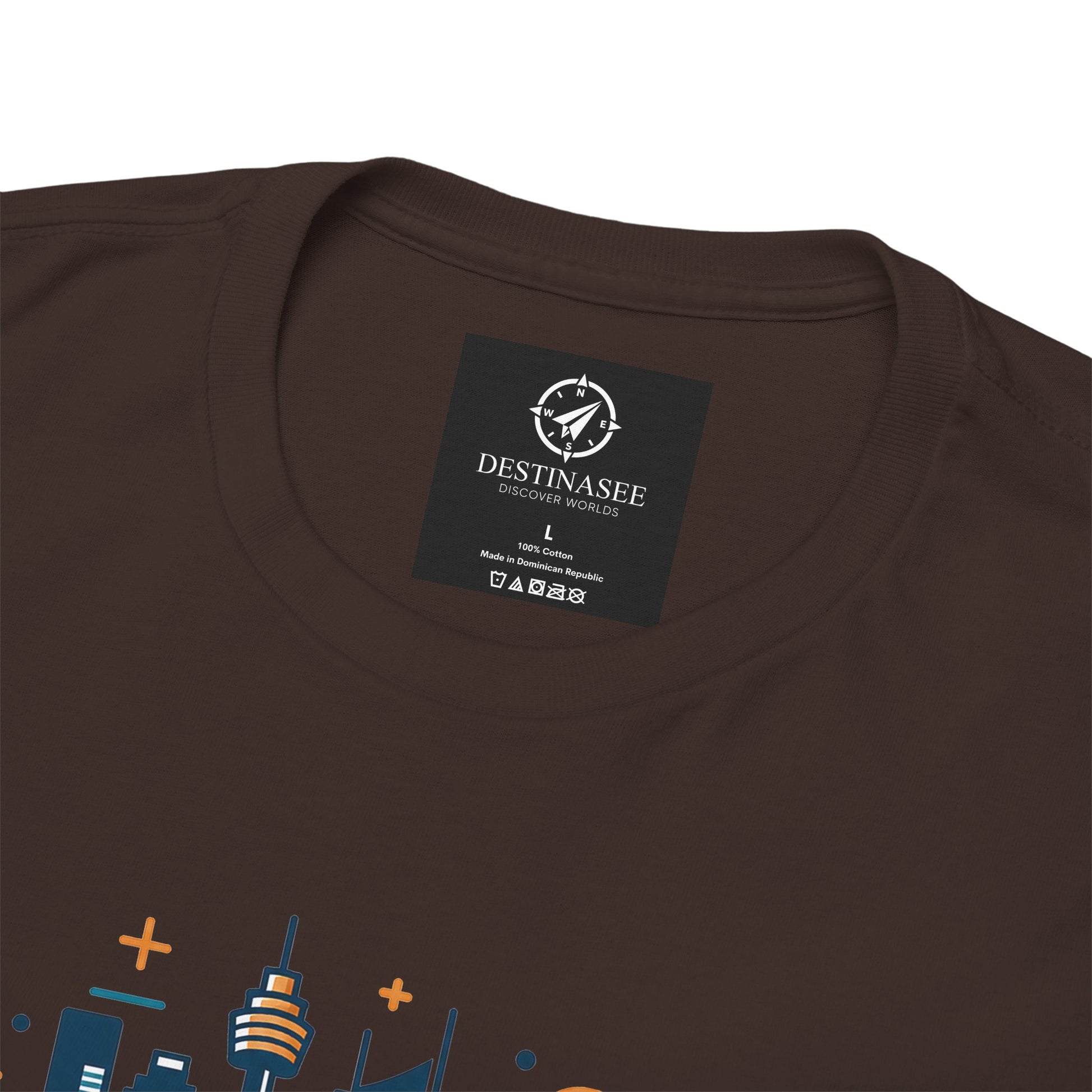 Dark brown crew-neck T-shirt close-up showing neckline label and partial cityscape graphic.