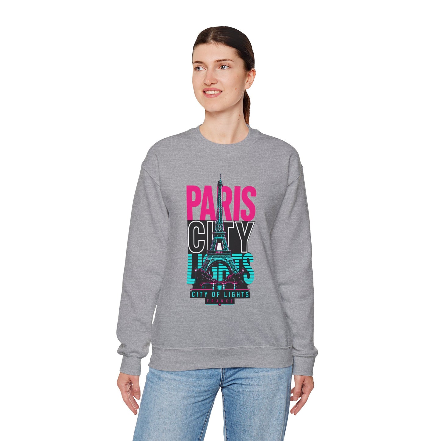 Gray crewneck sweatshirt worn by model, featuring PARIS CITY Eiffel Tower lights graphic.