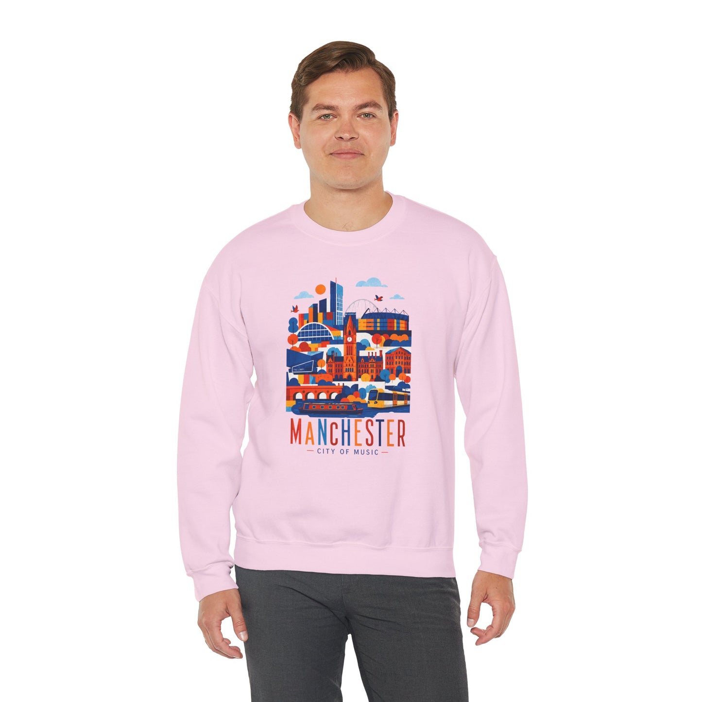 Light pink crewneck sweatshirt with colorful Manchester cityscape graphic on front