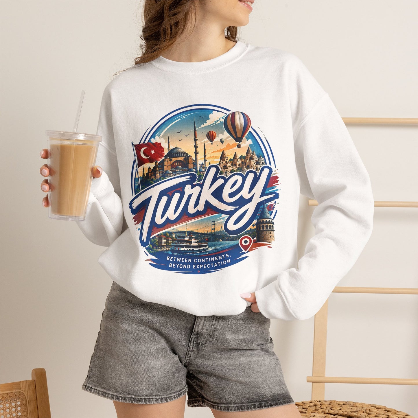 White crewneck sweatshirt with large “Turkey” graphic and text beneath, long sleeves