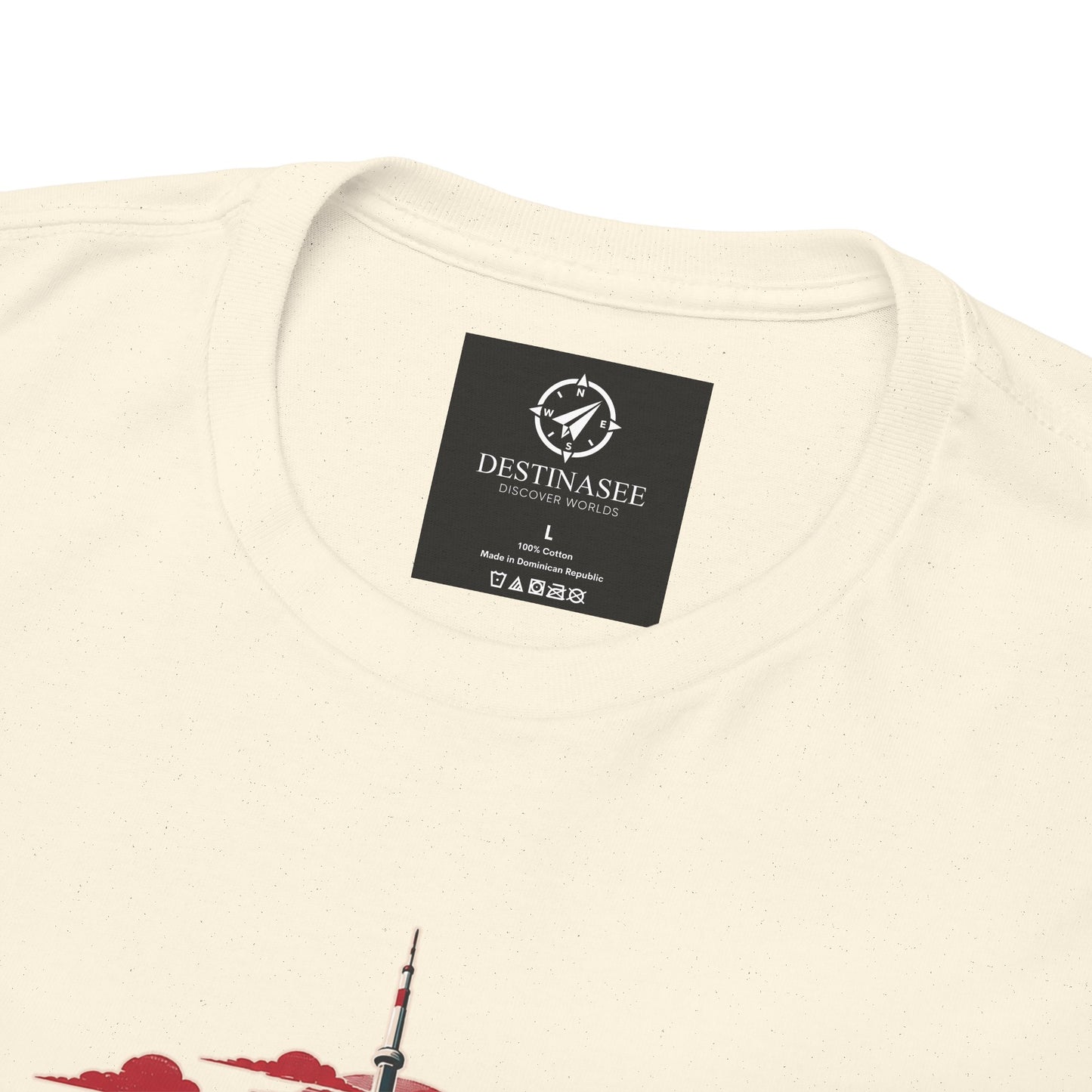 Natural T-shirt close-up: neck label and partial Toronto skyline graphic
