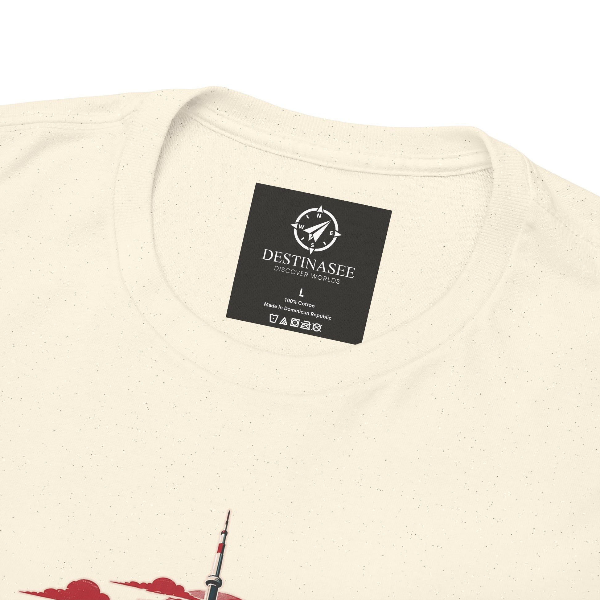 Natural T-shirt close-up: neck label and partial Toronto skyline graphic