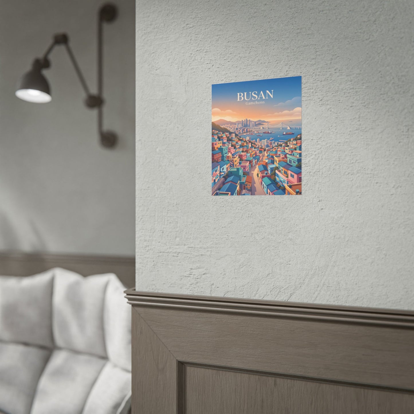 Rolled travel poster with Busan Gamecheon cityscape illustration, mounted on a wall