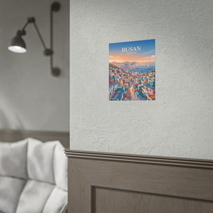 Rolled travel poster with Busan Gamecheon cityscape illustration, mounted on a wall
