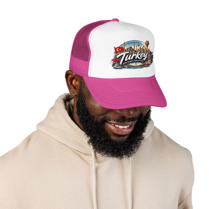 Turkey travel trucker hat with white front, magenta mesh sides, worn by a man