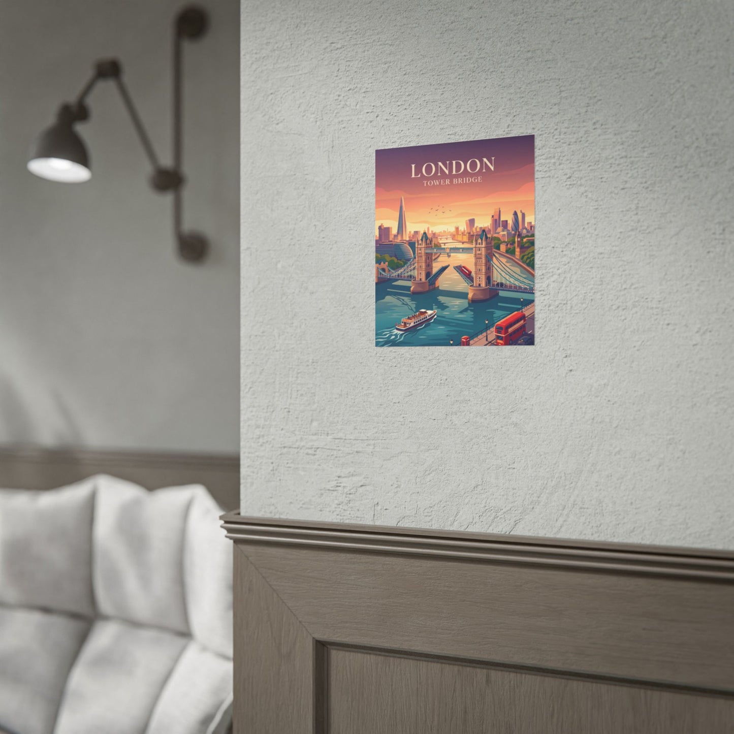 Small Tower Bridge poster print with riverboats and a red bus on a wall.