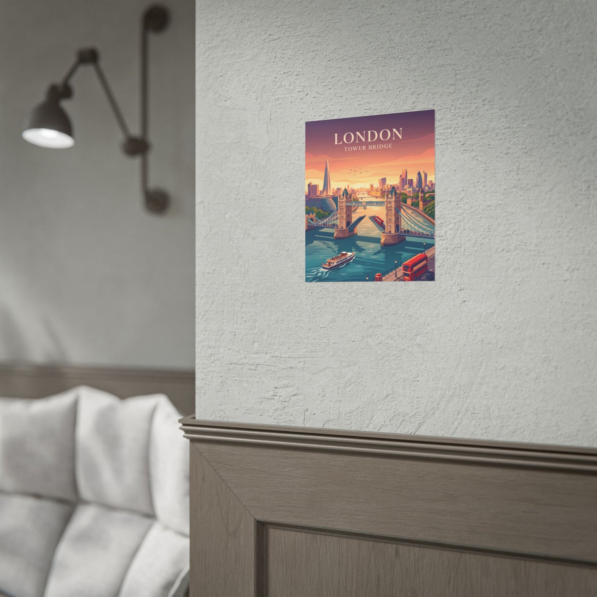 Small Tower Bridge poster print with riverboats and a red bus on a wall.