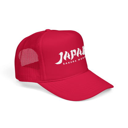 Red trucker hat with mesh side panel and JAPAN SAKURA WONDER logo.
