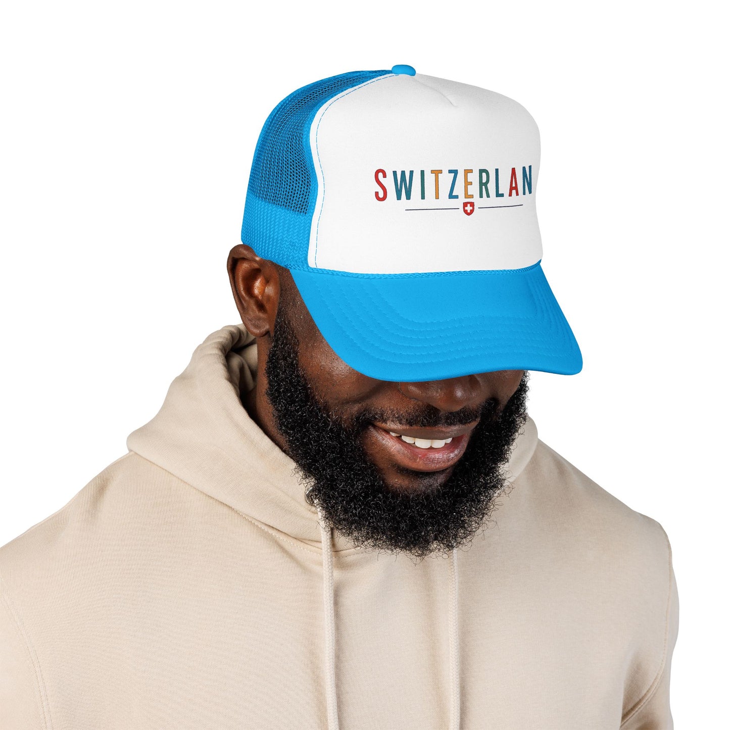 Blue and white foam trucker cap with mesh back, worn forward, "SWITZERLAN" logo