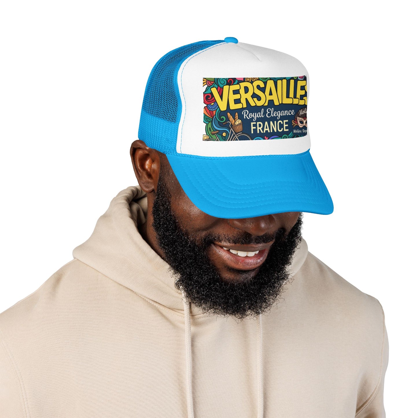 Blue and white trucker cap with mesh panels and “Versailles” graphic patch on front