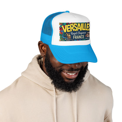 Blue and white trucker cap with mesh panels and “Versailles” graphic patch on front