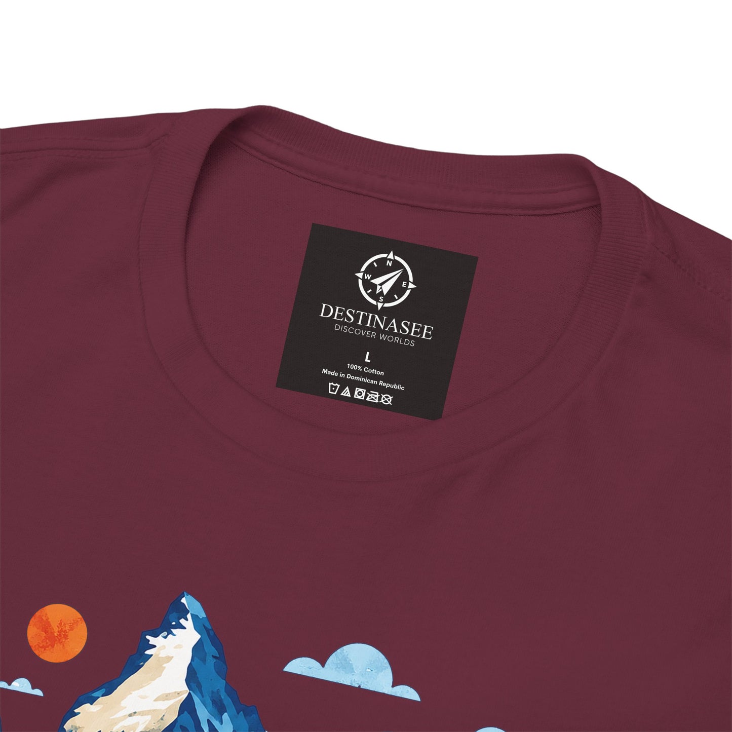 Close-up of maroon t-shirt back neck logo and partial mountain graphic.