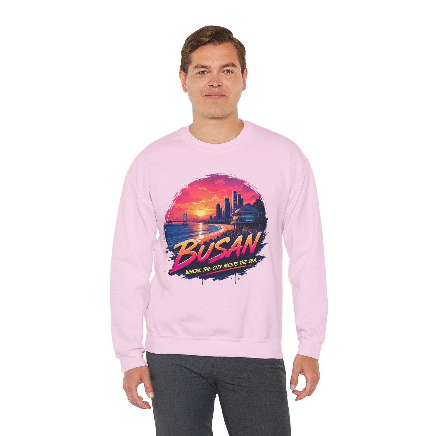 Light pink crewneck sweatshirt with long sleeves and colorful front graphic print.