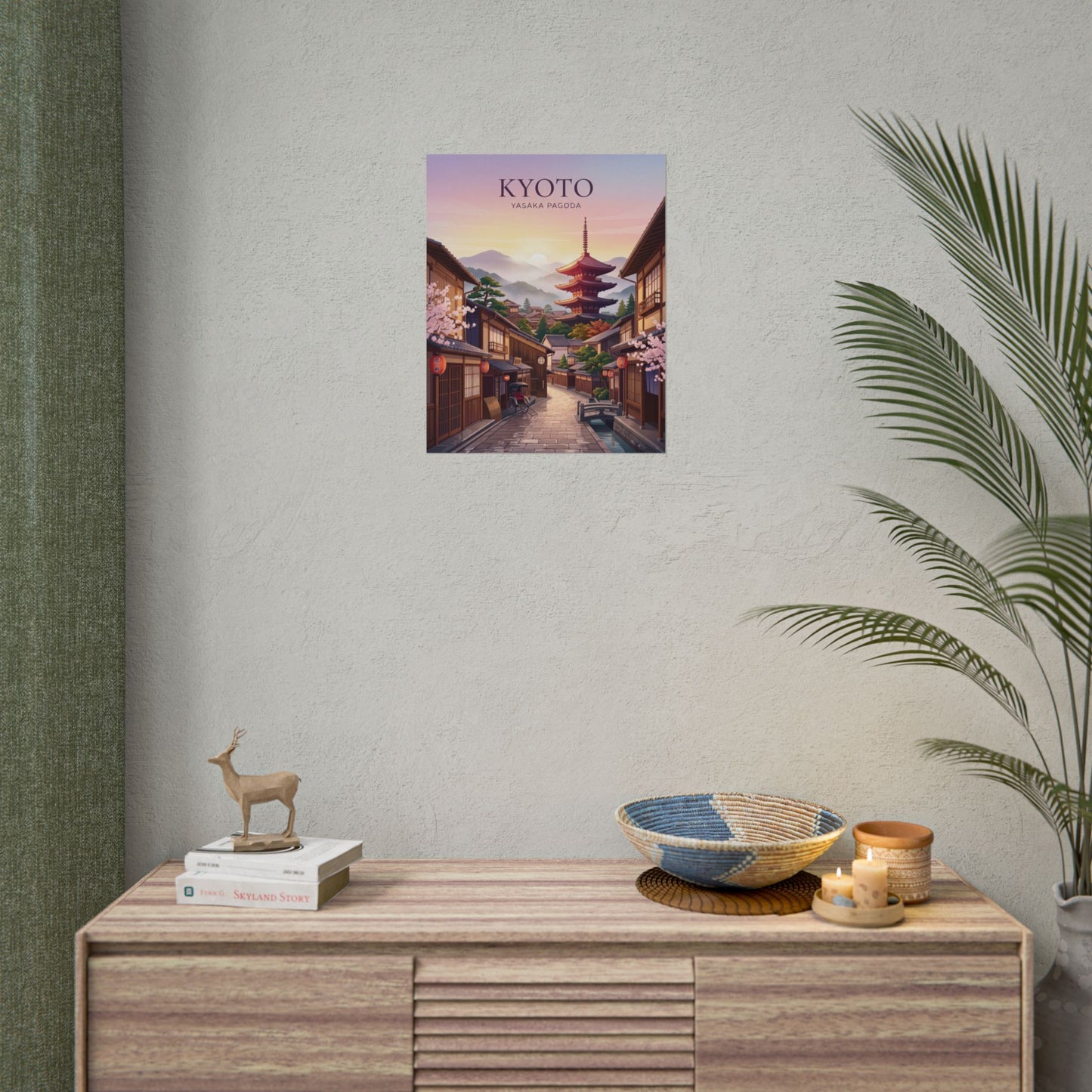 Rolled poster shown on a wall: Kyoto street with Yasaka Pagoda at sunset, title text visible.