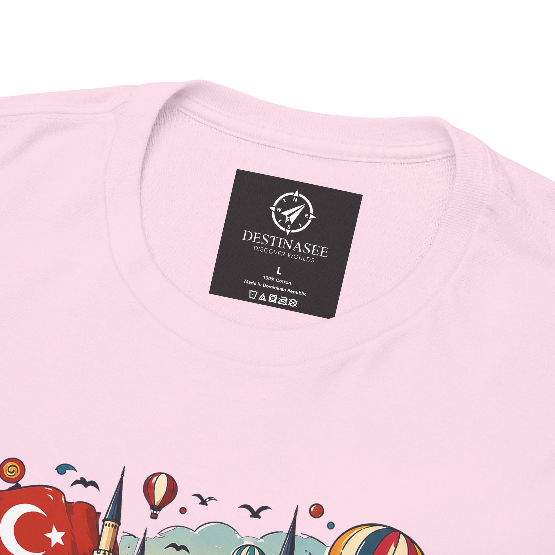Light pink tee with Destinasee neck label and partial Turkey artwork close-up