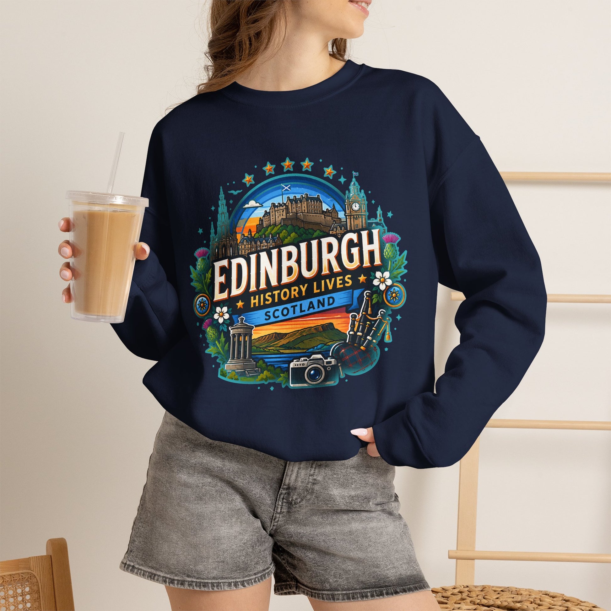 Navy crewneck sweatshirt worn by model with front “Edinburgh” graphic print