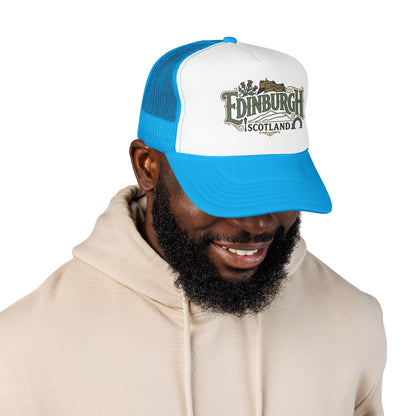 Blue and white trucker cap with mesh sides and curved brim; “Edinburgh Scotland” front logo.
