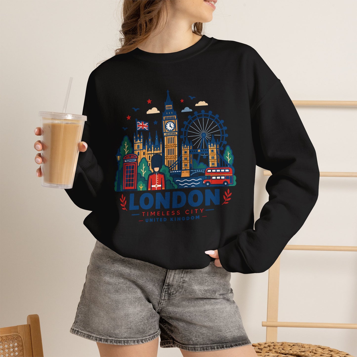 Black crewneck sweatshirt with colorful London skyline graphic and logo on chest