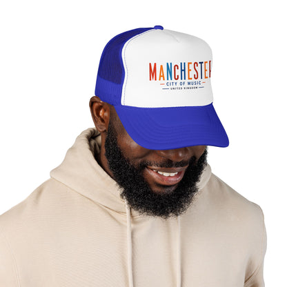 White and blue trucker hat with embroidered Manchester City of Music logo on front