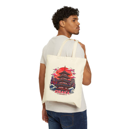Natural cotton tote bag with colorful Osaka graphic worn over the shoulder by a man