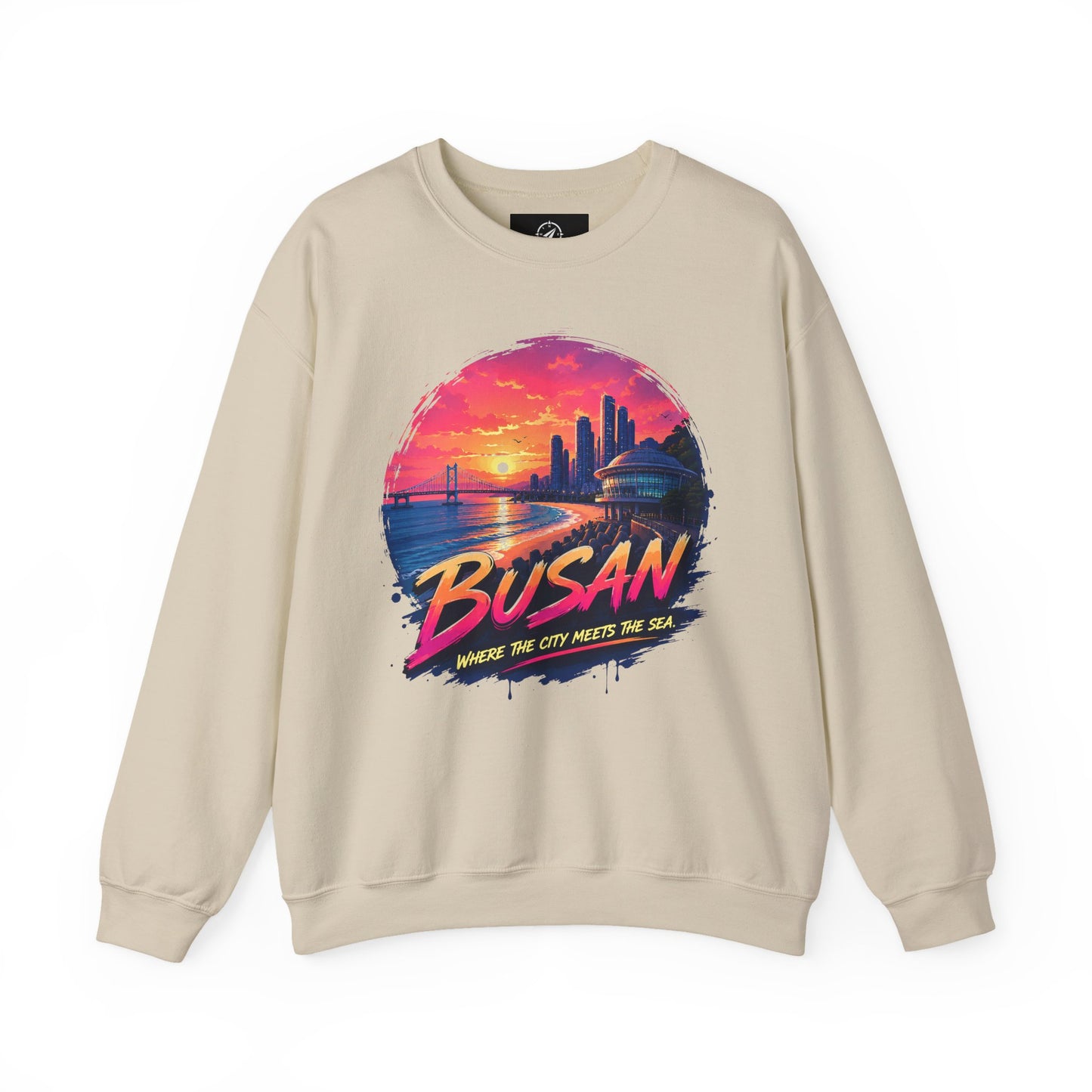 Sand-colored crewneck sweatshirt with Busan sunrise city graphic on the chest.