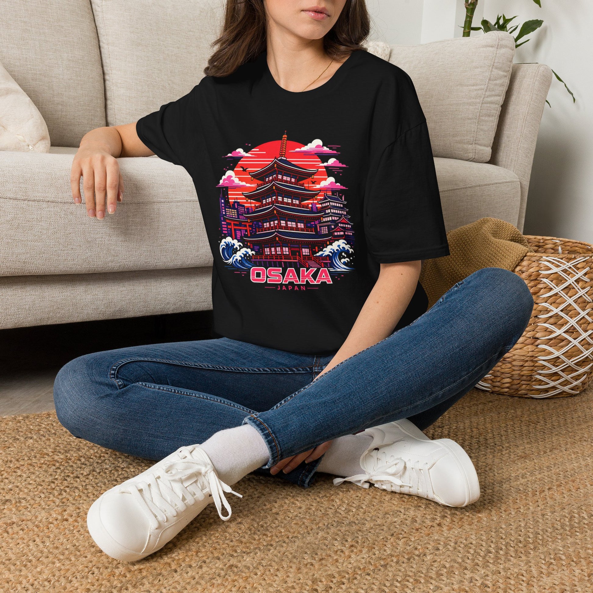Black T-shirt with Osaka graphic print, worn by a person sitting.