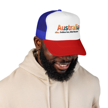 Blue and white trucker cap with red brim; embroidered “Australia” graphic on front.