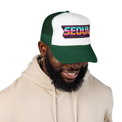 Dark green and white trucker hat with “SEOUL South Korea” logo patch, worn by model