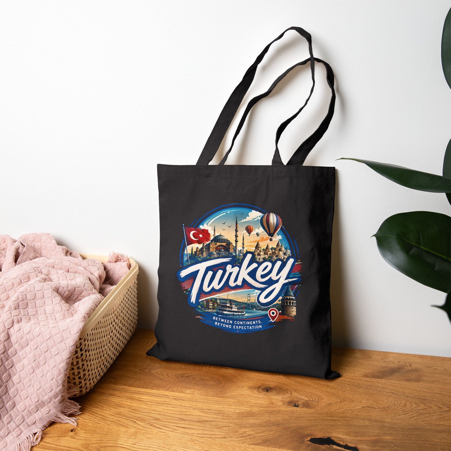 Black canvas tote bag with stitched handles and large Turkey front print