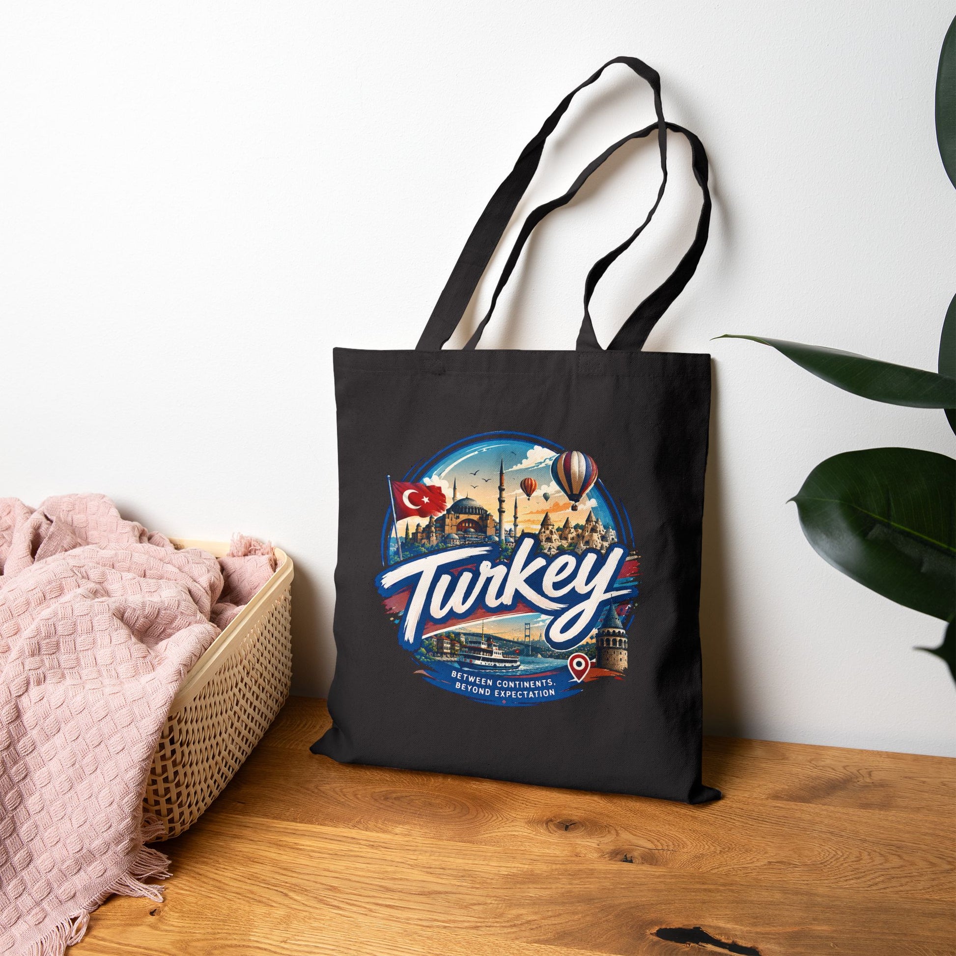 Black canvas tote bag with stitched handles and large Turkey front print