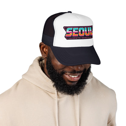 Black and white trucker hat worn by man, front Seoul logo graphic