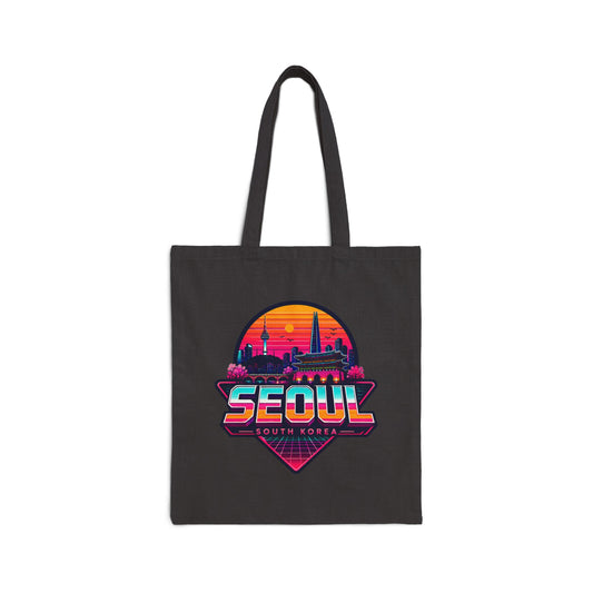 Black canvas tote bag with colorful Seoul skyline graphic and Seoul text.
