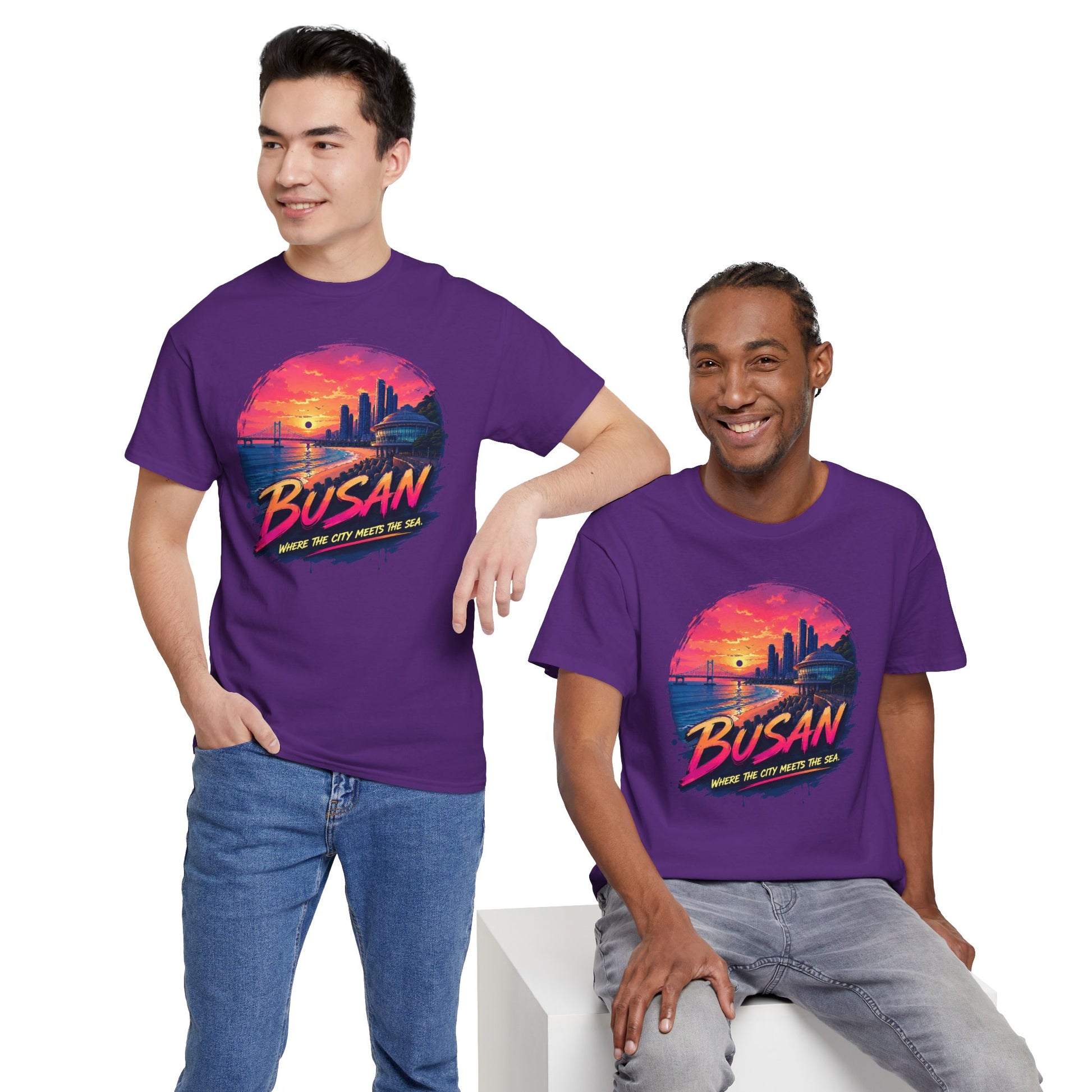 Purple crew-neck T-shirt with Busan sunset city graphic, worn with blue jeans.