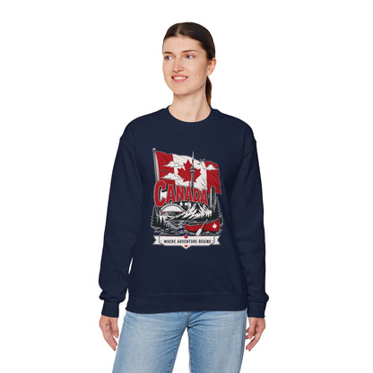Navy crewneck sweatshirt on model with Canada flag canoe graphic and long sleeves.
