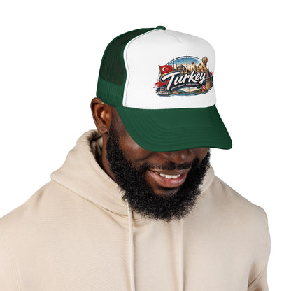 Turkey travel trucker hat with white front and dark green mesh sides, worn by a man