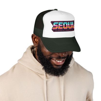 Dark green and white trucker hat with “SEOUL South Korea” logo patch, worn by model