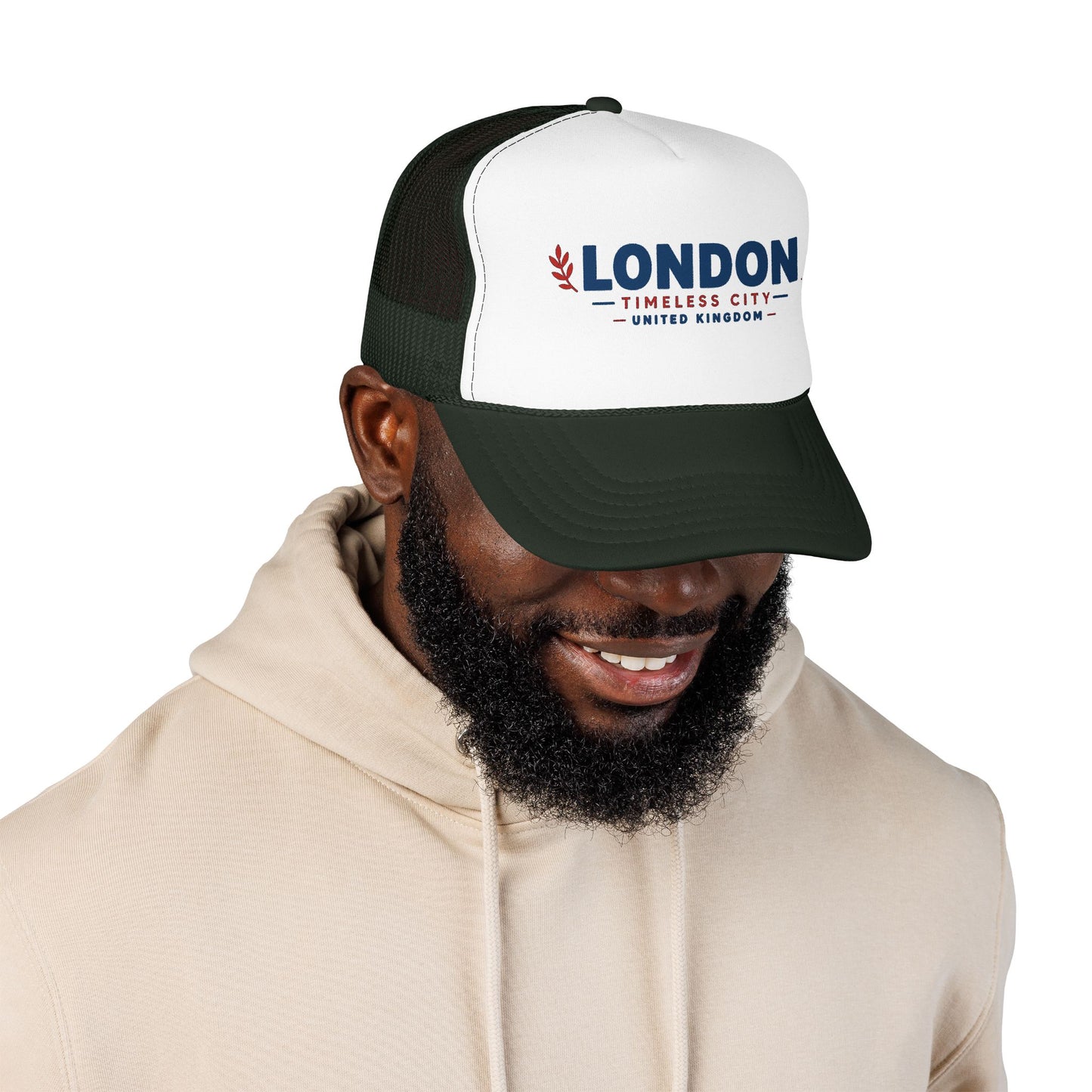 Black-and-white trucker hat with white front panel, green mesh sides, LONDON logo