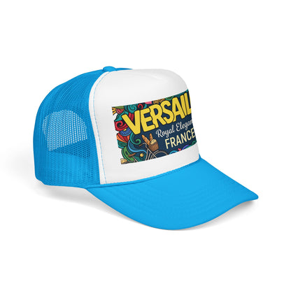 Blue and white trucker hat with mesh sides and colorful “Versailles” front patch