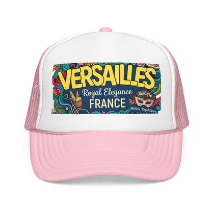 Pink and white trucker hat with mesh side panels and colorful 'Versailles France' front patch