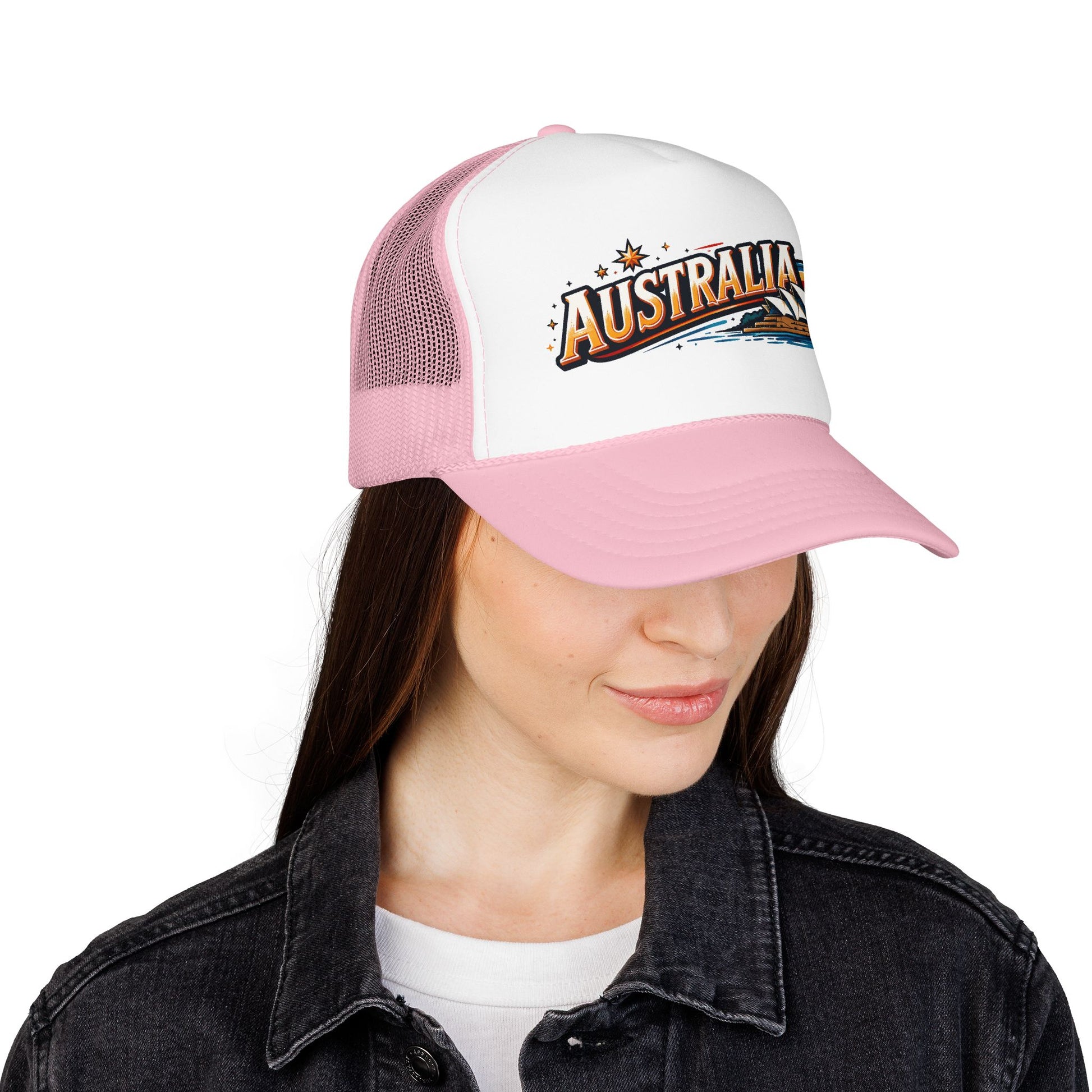 Trucker cap light pink and white mesh worn by woman; Australia logo patch on front