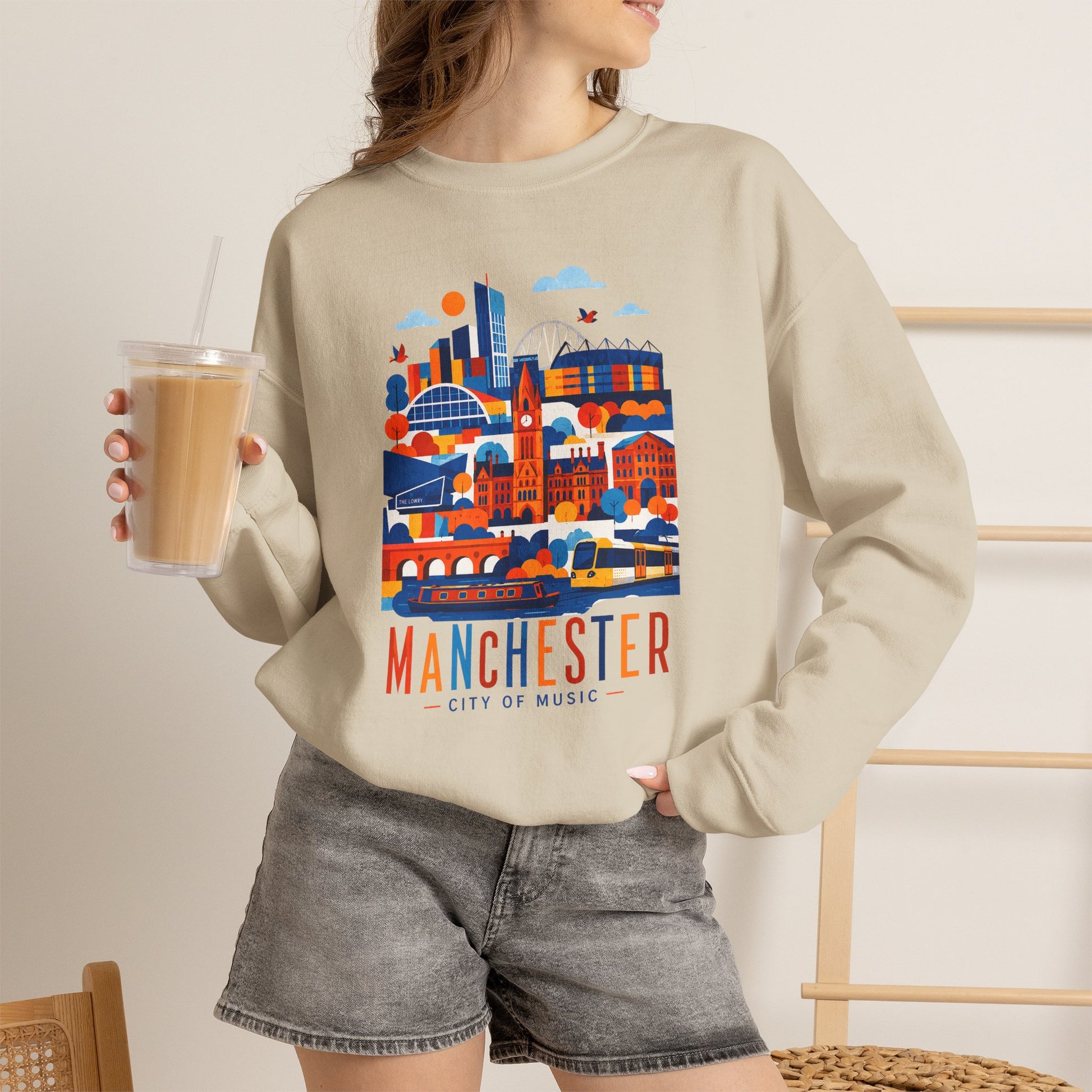 Light sand crewneck sweatshirt with colorful Manchester city graphic on front