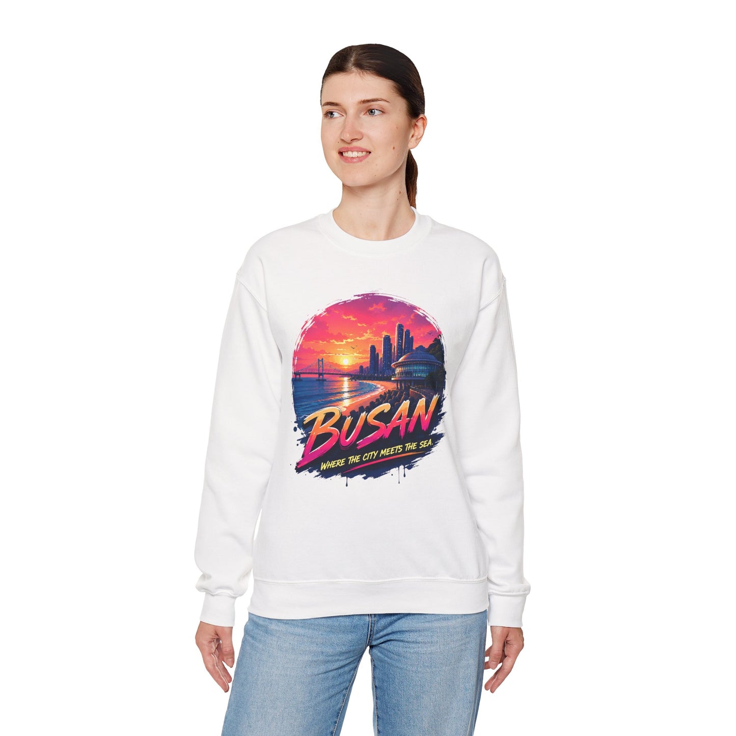 White crewneck sweatshirt with Busan sunrise city graphic on the chest.