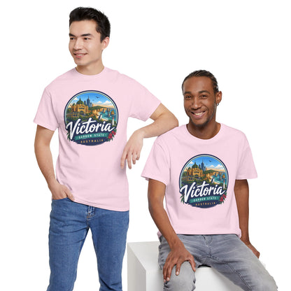 Pink crew-neck travel tee with circular Victoria city graphic, worn with jeans