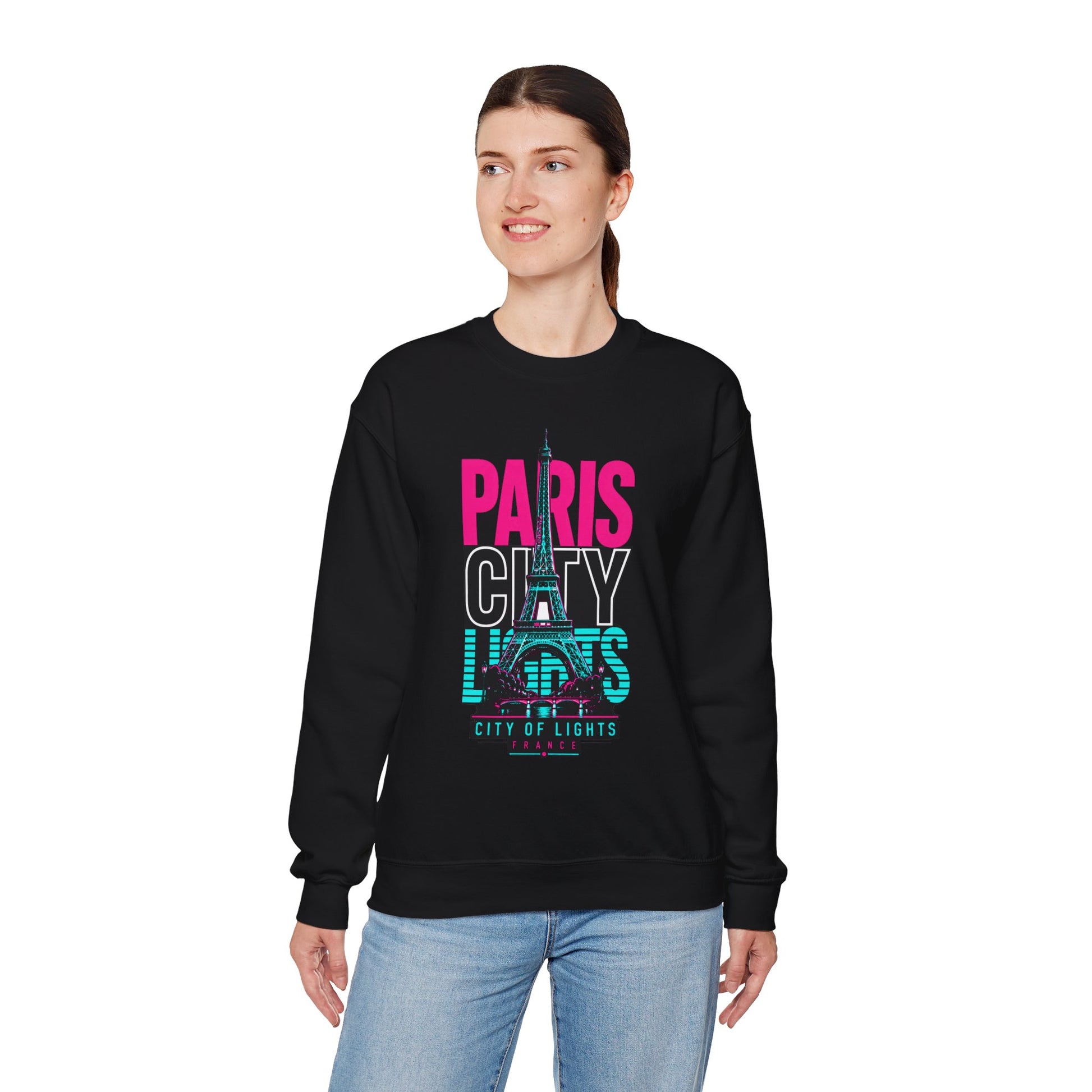 Black crewneck sweatshirt worn by model, featuring PARIS CITY Eiffel Tower lights graphic.