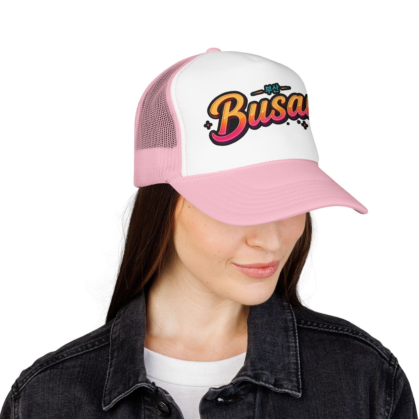 Pink and white mesh trucker hat with front “Busan” logo embroidery