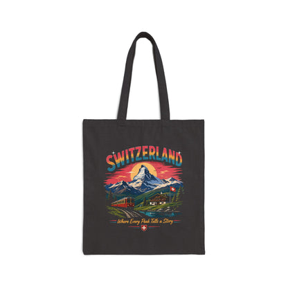 Black canvas tote bag with Switzerland graphic and long top handles.
