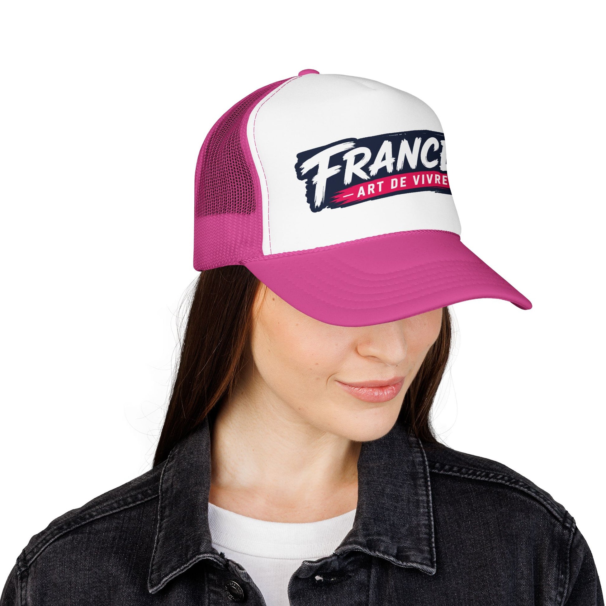 Trucker hat worn on head: white front with 'FRANCE' graphic, magenta mesh, pink brim