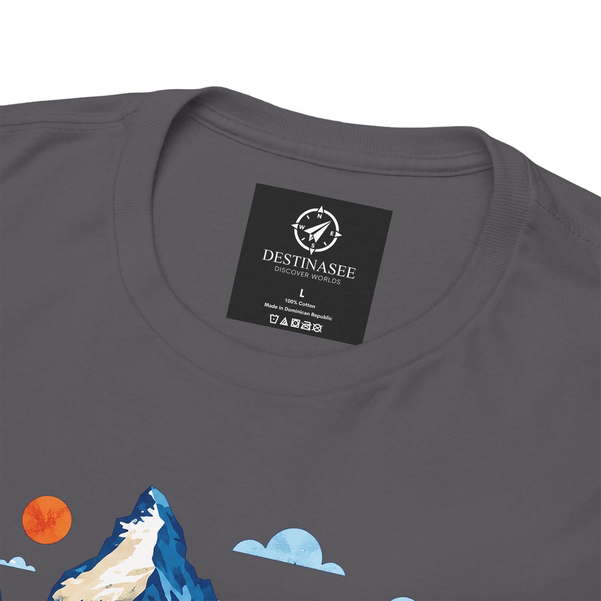 Charcoal gray T-shirt neckline with black brand label and partial mountain village print